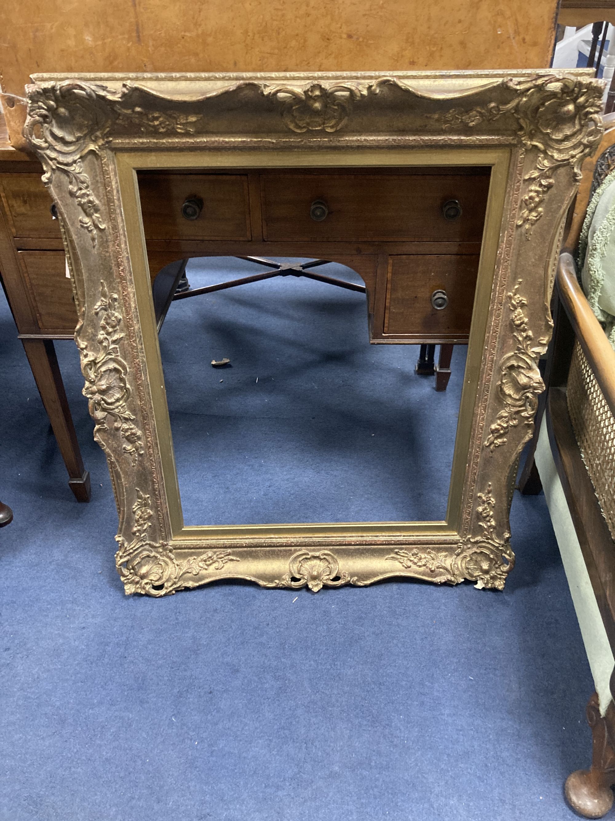A large Victorian tan leather travelling trunk, width 76cm, depth 52cm, height 58cm together with a rectangular gilt gesso picture fram